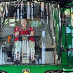 Diana driving a combine
