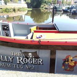 Heidi the pirate's Jolly Roger boat with a painting of her first mate Bonnie the French Bulldog