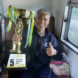 Man and his family on their way home from a successful marathon run
