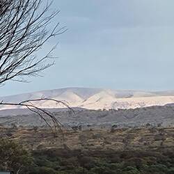 Clouds and sunlight hitting the mountains