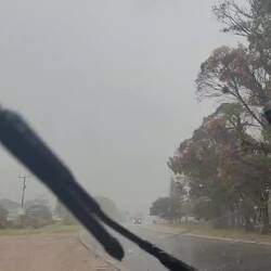 Stopped at the side of the road to wait the passing of hail.