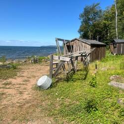 Manitou Island Fish Camp. That is a net wheel in the foreground. They would wind their nets on it.
