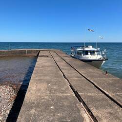 It's a cement dock. With rails that were used for a trolley car to bring supplies up to the building