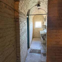 A bathroom in the tunnels within the world war 2 fortifications; that window is in the cliff face!