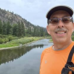 Evening walk along the Clark Fork River with recommended bear spray.