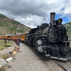 Ready to depart. The poor engineer explains--once again--to a passenger how he achieved his position