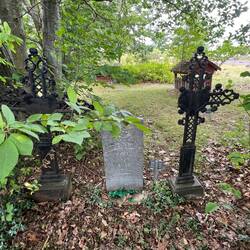 This grave had some interesting sculpture pieces next to it.