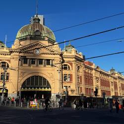The facade of the grand Flinders Street Station and clocks above the main front entrance