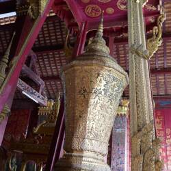 The King's coffin as they are buried kneeling in a prayer position before cremation