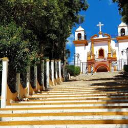 A small church on top of a hill.