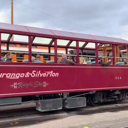 The diesel-hauled train departs ahead of us