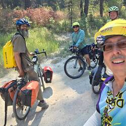 Sharing trail knowledge with another cyclist heading eastward. Ian with his dog Sandy.