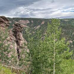 Ancient lava plugs, revealed by erosion of surrounding land. I've forgotten the names given to them.