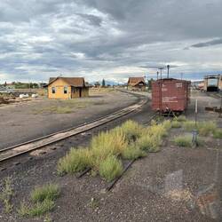 Rolling into Antonito yard, we loop around behind the workshop to reach the depot (left of boxcar)