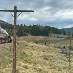 The southbound train approaches Osier past the balloon loop and a waiting light engine