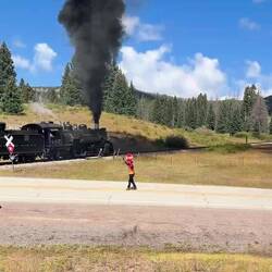 Level crossing at Coxo. Train on the 4% up the valley