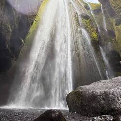 Gljúfrabúi waterfall; in a very wet cave