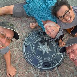 Team photo at the declared center of the universe. Bo, Chris, Ger and Jack