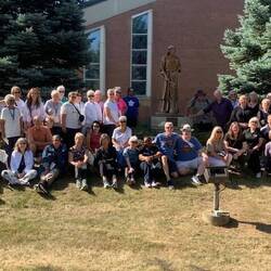Group photo around statue of St. Joseph