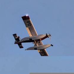 1 of 4 firefighting planes flying by hourly to put out wild fires