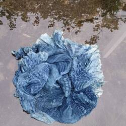 A blue sunflower, silk pleating, indigo dye stitch