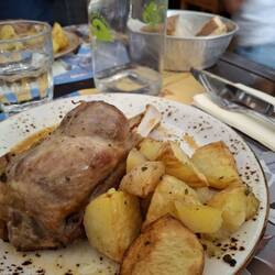 Roast pork shank and potatoes