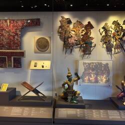 Indian-influenced artifacts from pre-colonial Southeast Asia, including Javanese wayang kulit.