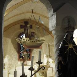 In the crypt - the ship was a light made from kerosene tins (I think)