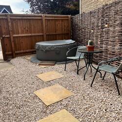 Our private patio and hot tub at the Room Next Door in Winchcombe.