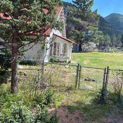 Abandoned track worker's section house about halfway up