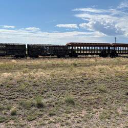Two steel frames for new C&TSRR passenger cars, and some old rollingstock at Antonito