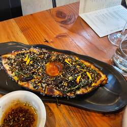 Pide with corn, mushrooms, greens, sumac pickled onions
