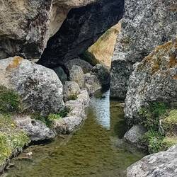 The canal begins in a long basin behind this stone