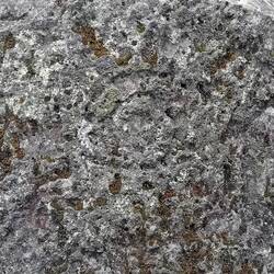 The water/snail symbol carved on the round stone