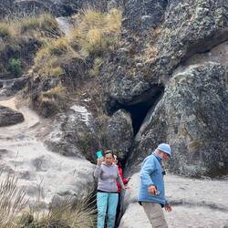 Exiting a steep narrow tunnel up through the rocks