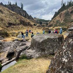 The carved sacrificial rock beside the canal