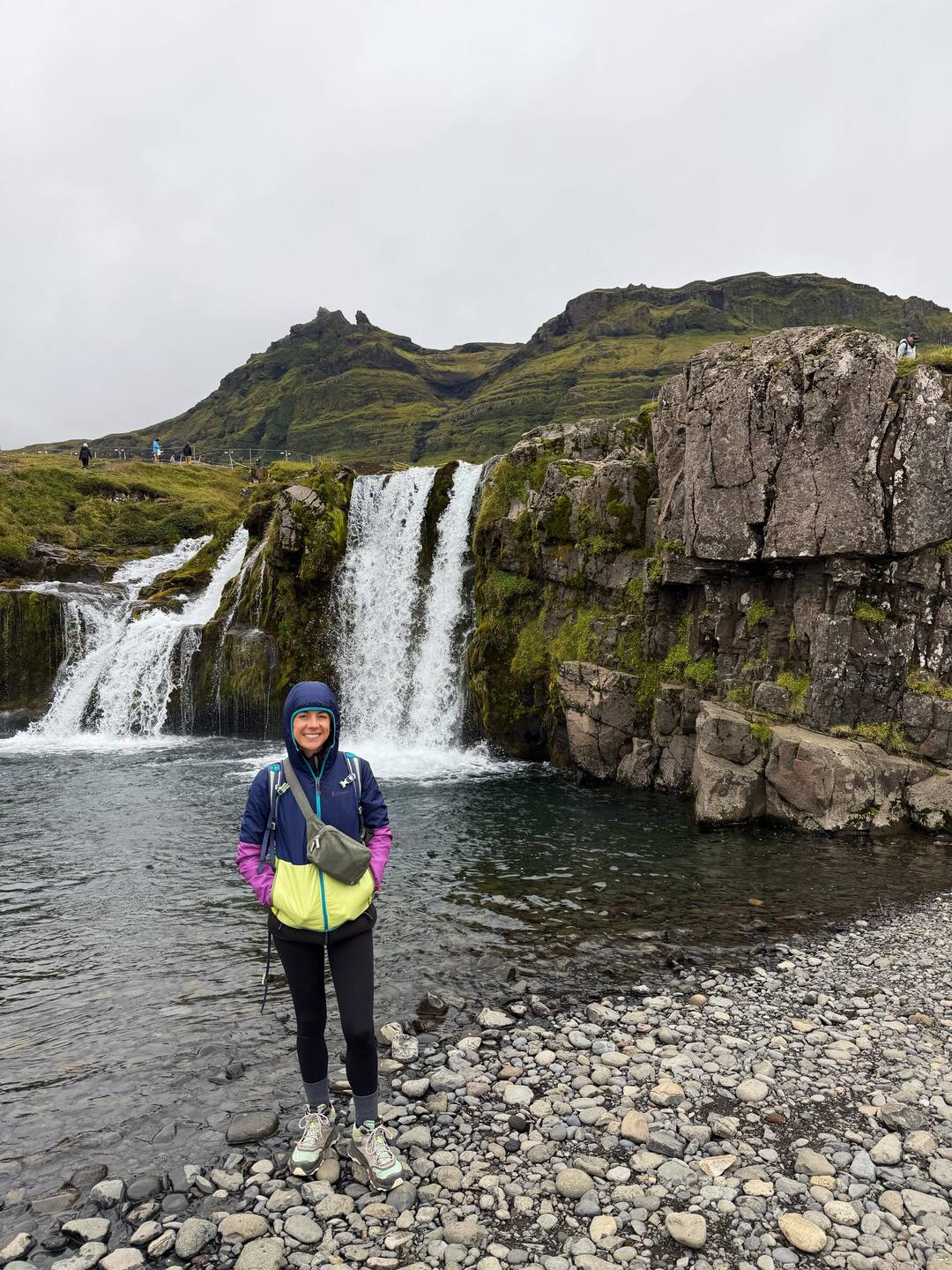 Chelsea at the waterfall in front of Kirkjufell mountain