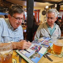 Eric signing his Whitby Dracula art in N&Tis Cleveland Way book