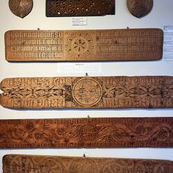 Carved bed boards put at the side of the entry point. It doubled for extra table space at meal time.