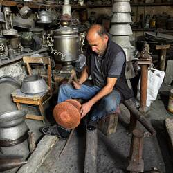 Working on a copper pot