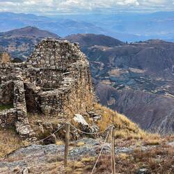 The round structures are right on top of the cliff!