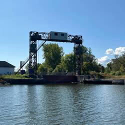 The Utica Harbor Lock. This lock uses a gate that is raised up high for Canal work boats to enter.