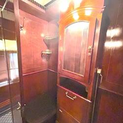 A fold-down seat in a cabin that covers a toilet