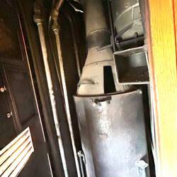 Coal-fired central heating boiler at servant's end of car