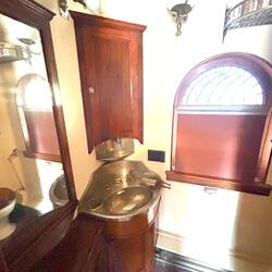 Bathroom. Basin water supply in a tank inside that corner cupboard.