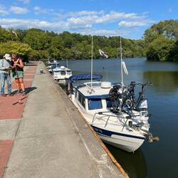 C-Traveler, C-Otter and Mystery Girl on the cement wall at Riverfront park