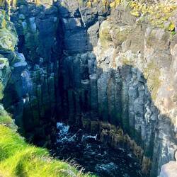 Basalt columns revealed in the hole.