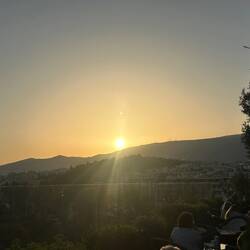 The sun rising over Athens