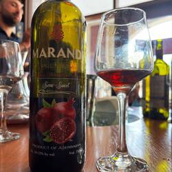 Pomegranate wine would be an acquired taste. It's quite sour.