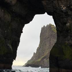 Drangarnir rock formation through the sea arch